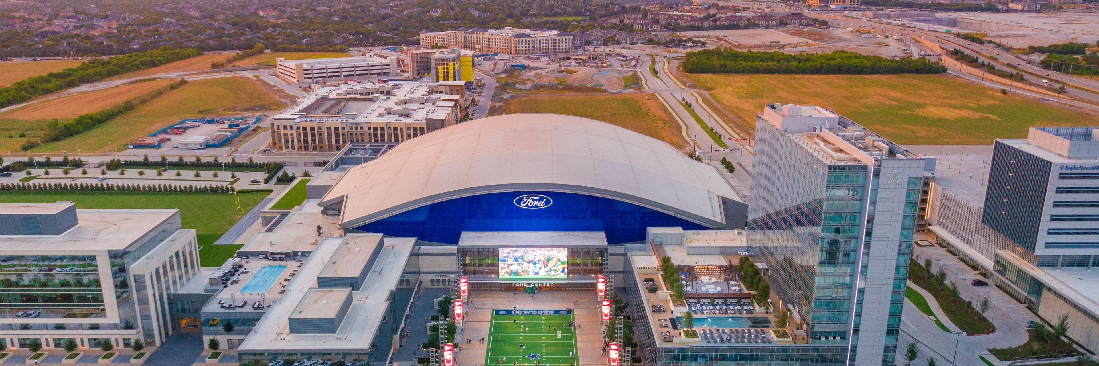 Aerial image of the Star in Frisco with Ford Center at The Star, the Omni Frisco Hotel, Tostito's Plaza and hotels under construction in the background.