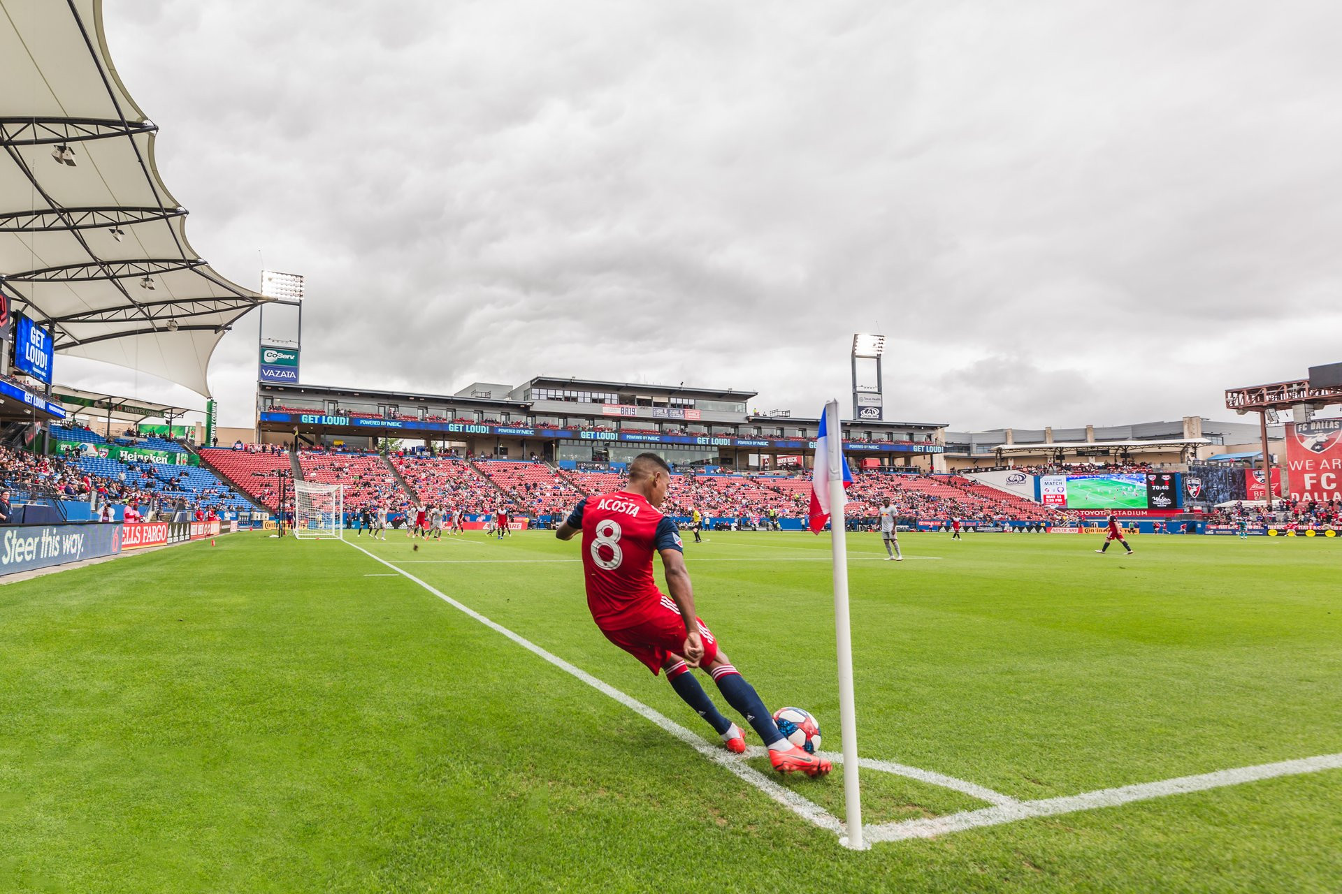 An FC Dallas player does a corner kick at Toyota Stadium.