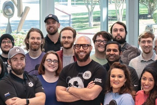 Employees at Asset Panda gather for a posed photo.